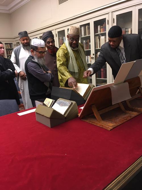 Five imams visiting the Rare Books Department